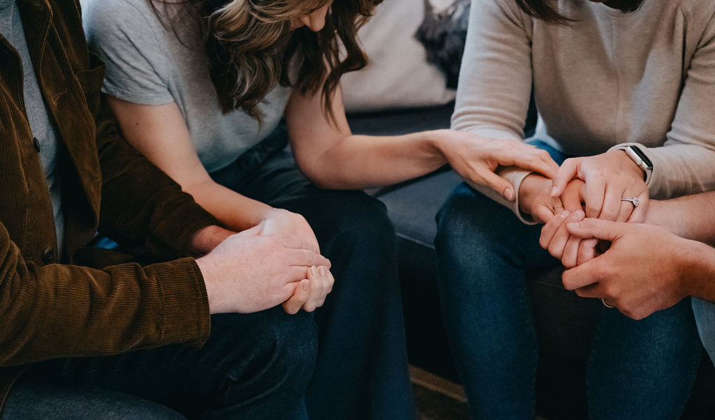 Praying with couple